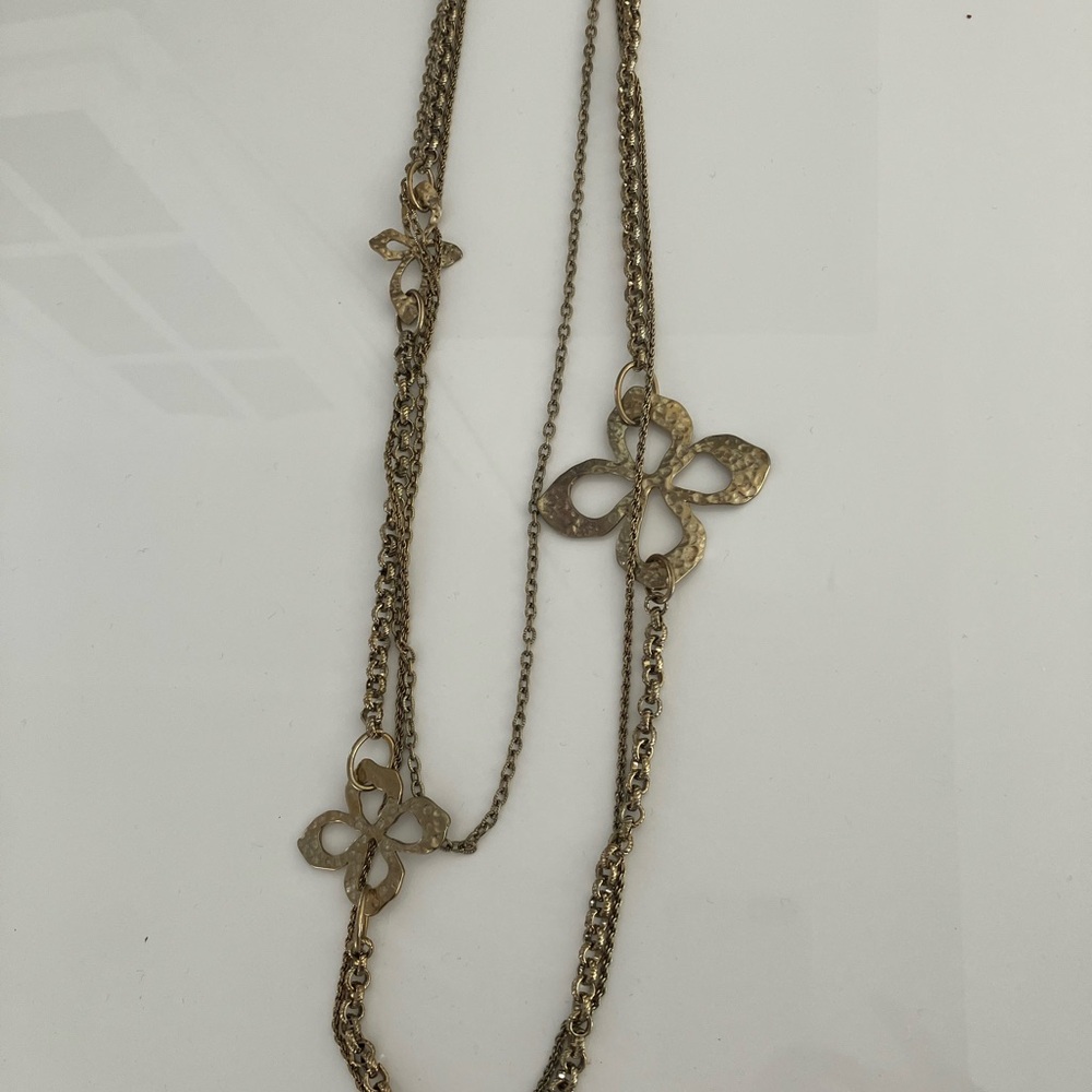 Anthropologie Gold Necklace with Floral Charms new without tags.